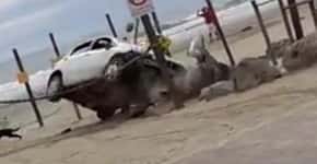 Mulher invade praia interditada e tenta atropelar homem; veja o vídeo