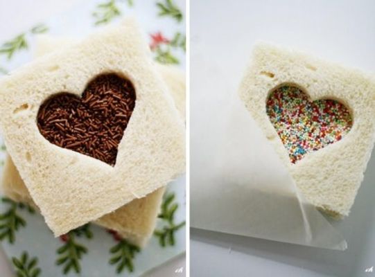 Corte o pão de forma com um cortador em formato de coração. Recheie com Nutella ou brigadeiro de colher e cubra com granulados ou confeitos coloridos.