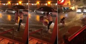 Mulher cai e é arrastada por enxurrada em frente a restaurante