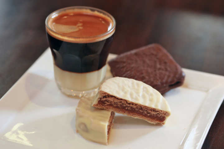 coffee with chocolate cookie and alfajor