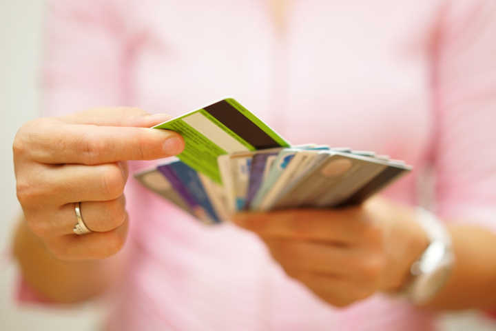 woman choose one credit card, concept of credit debt