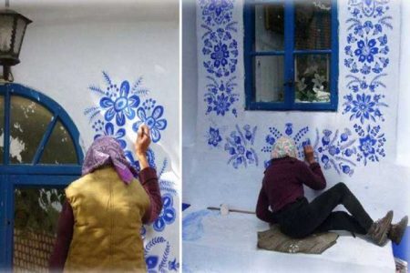 Mulher de 87 anos se aplica em pintar as casas de vizinhos