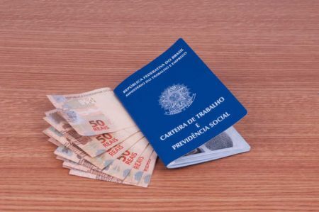 Brazilian work document and social security document (carteira de trabalho) and brazilian currency (Real)
