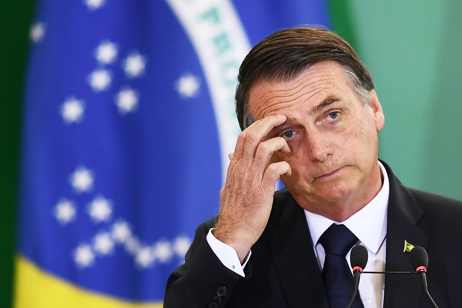 Brazilian President Jair Bolsonaro delivers a speech during the appointment ceremony of the new heads of public banks, at Planalto Palace in Brasilia on January 7, 2019. – Brazil’s Finance Minister Paulo Guedes appointed the new presidents of the country’s public banks. (Photo by EVARISTO SA / AFP)