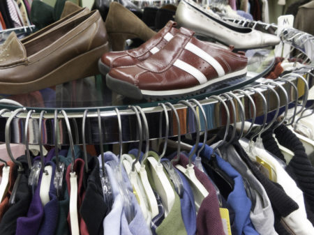 Used clothes and shoes at a secondhand consignment shop