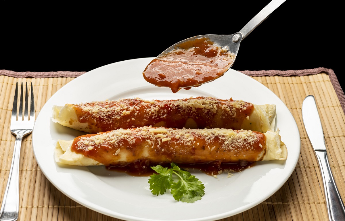 ground meat pancakes covered with red sauce and grated cheese