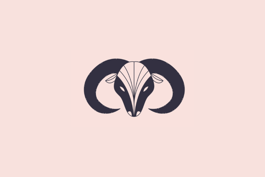 Ilustração estilizada e minimalista da cabeça de um carneiro, simbolizando o signo de áries, em tom azul-escuro sobre um fundo rosa-claro