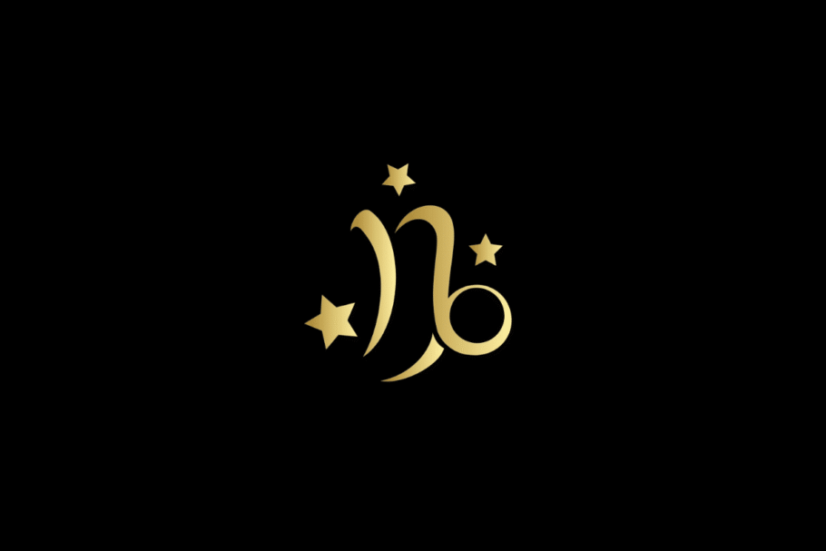 Ilustração minimalista do signo de capricórnio em dourado, centralizado sobre um fundo preto. O símbolo é acompanhado por três estrelas douradas de diferentes tamanhos