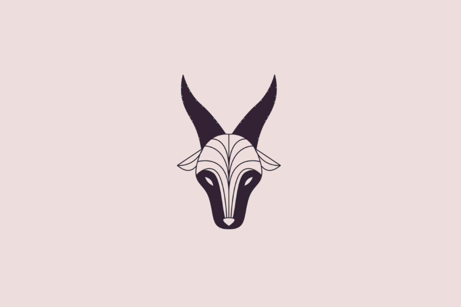 Ilustração estilizada e minimalista da cabeça de uma cabra, simbolizando o signo de capricórnio, em tom azul-escuro sobre um fundo rosa-claro