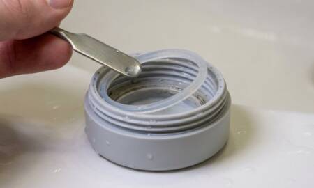 person-cleaning-bottle-seal-ring-450x270.jpg