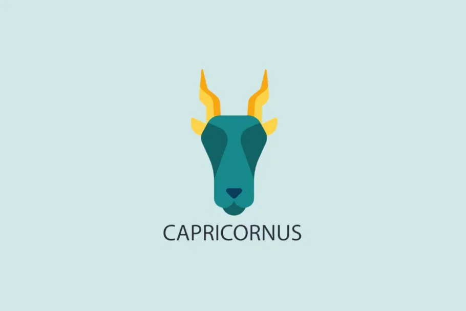 Ilustração vetorial em estilo plano da cabeça de um bode com chifres amarelos e pontiagudos, sobre um fundo azul-claro com a palavra "CAPRICORNUS" escrita abaixo.