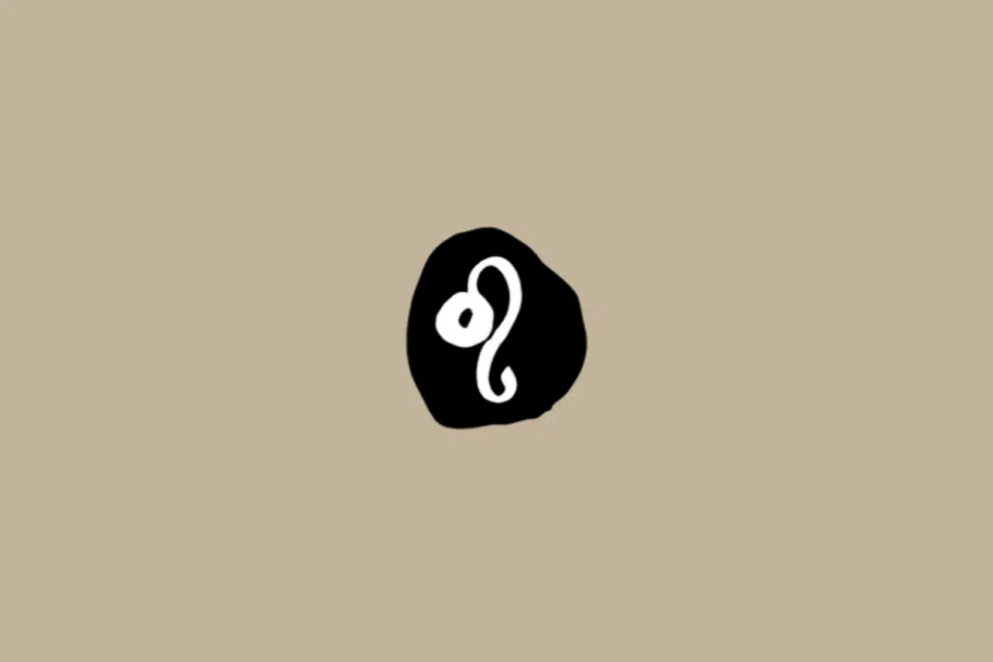 Símbolo do signo de Leão em branco dentro de um círculo preto sobre um fundo bege