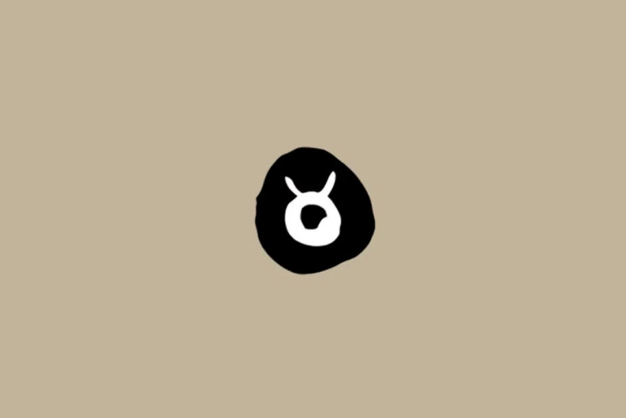 Símbolo do signo de Touro em branco dentro de um círculo preto sobre um fundo bege
