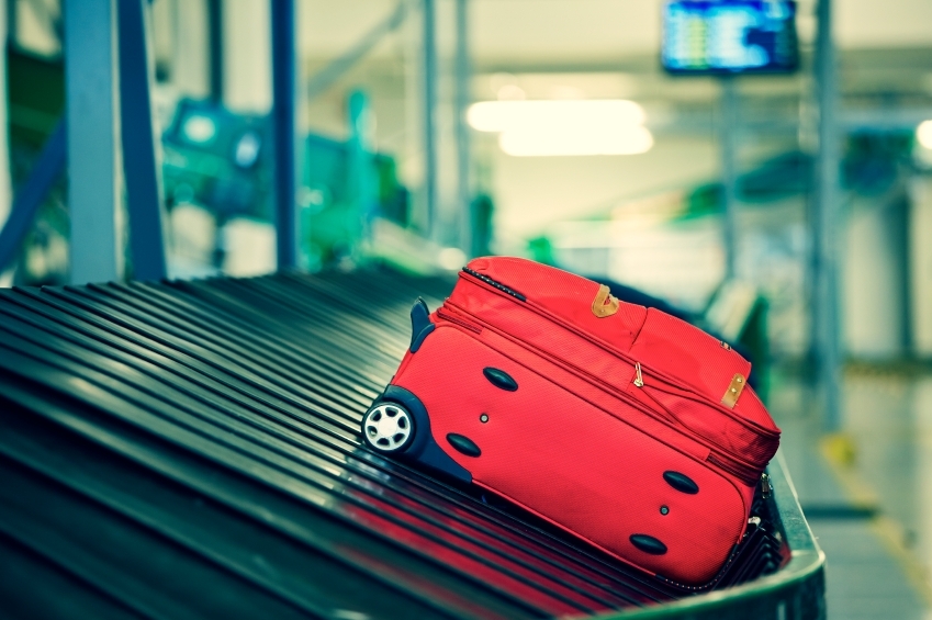 Baggage on conveyor belt at the airport - selective focus