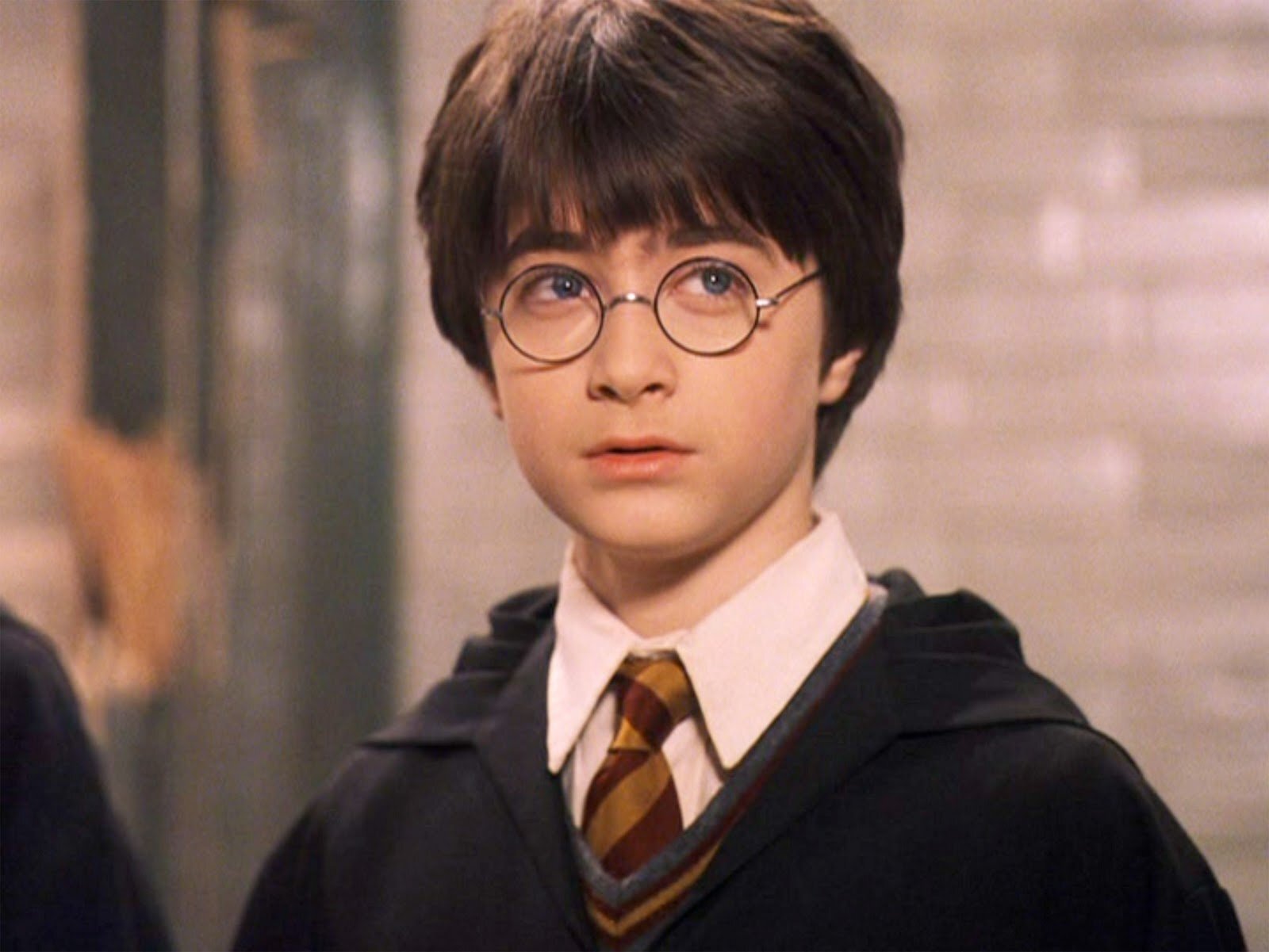 O ator Daniel Radcliffe em "Harry Potter e a Pedra Filosofal", de 2001, quando tinha 11 anos.